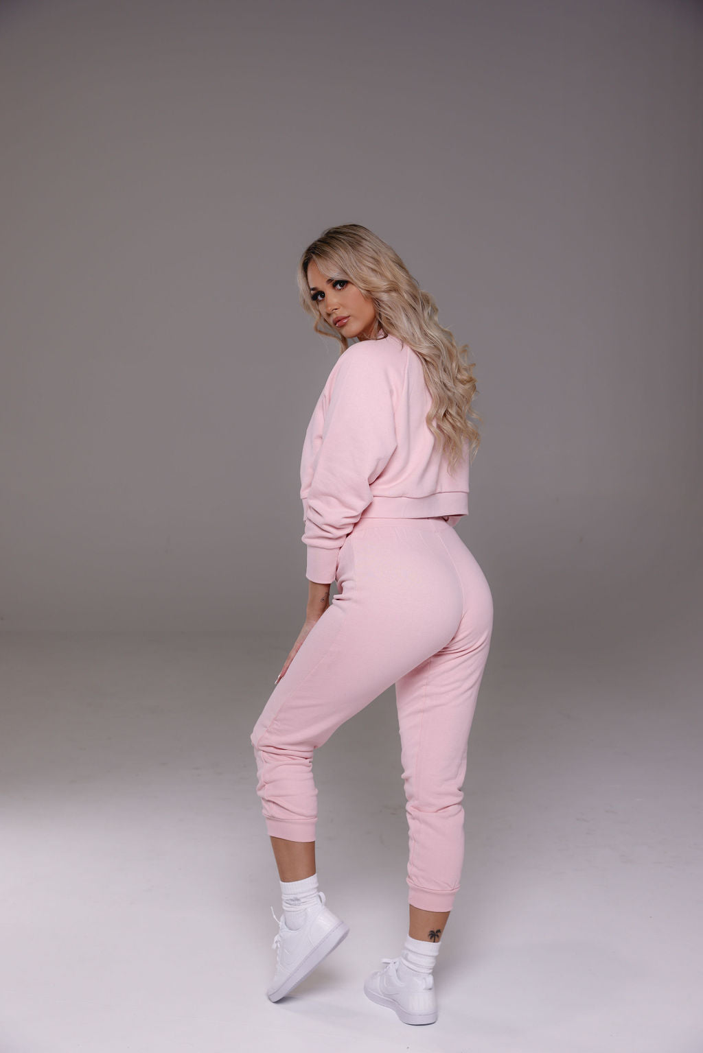Cropped track pants in pink from Stormm Co's Hues of Happiness collection, made from high-quality French terry cotton