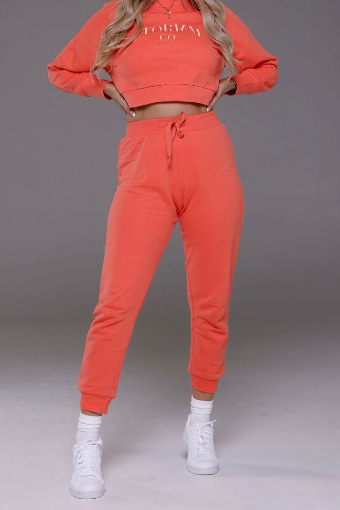 Cropped track pants in coral from Stormm Co's Hues of Happiness collection, made from high-quality French terry cotton