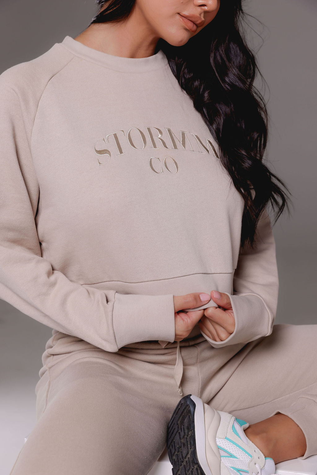Cropped jumper in tan from Stormm Co's Hues of Happiness collection, made from soft French terry cotton, relaxed fit, and embroidered unique design.