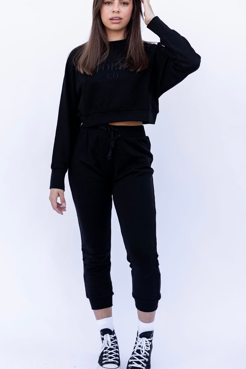 Cropped track pants in black from Stormm Co's Hues of Happiness collection, made from high-quality French terry cotton