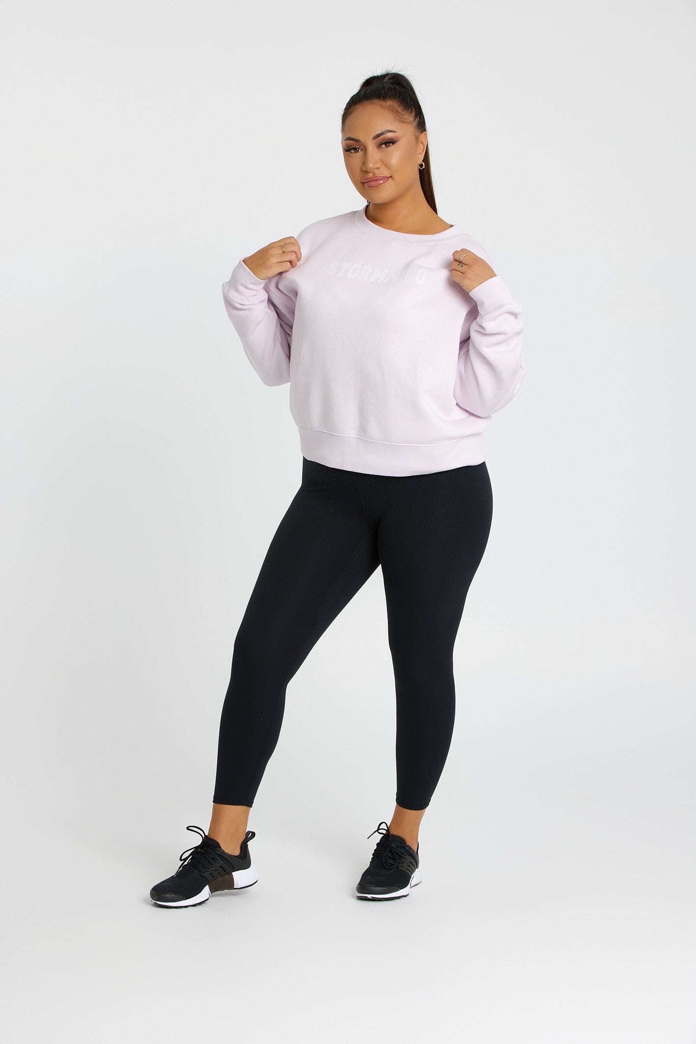Woman wearing creamy lilac mist jumper from our Soft Touch Collection, showcasing cozy and stylish winter fashion.